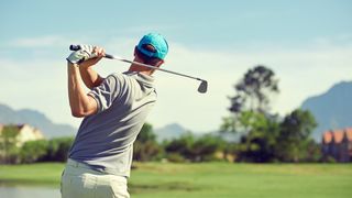 a photo of a man playing golf