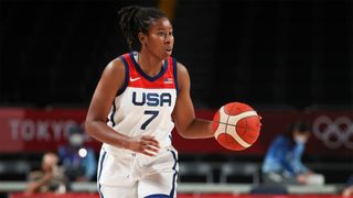 The USA's Ariel Atkins dribbles the ball during her team's match against Serbia at the Tokyo Olympics in 2021.