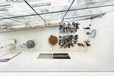 Norman Foster Institute interior seen from above showing white interiors and students sat listening to a lecture