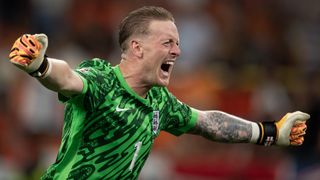 Jordan Pickford celebrates at Euro 2024 in his green England goalkeeper kit ahead of Spain vs England live streams