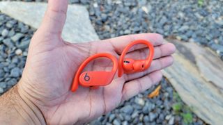 The Beats Powerbeats Pro held in hand