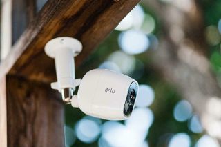 Arlo security camera mount under outdoor beam