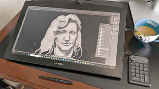 Huion Kamvas Pro 24 (4K) on desk.