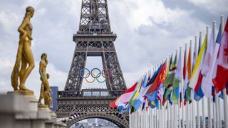 A general view of the Eiffel Tower with the Olympics rings pictured with national flags of competing countries from the Place du Trocadero ahead of Paris 2024 Olympic Games on July 21, 2024 in Paris, France.