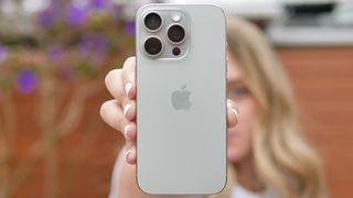 iPhone 16 Pro shown held in hand