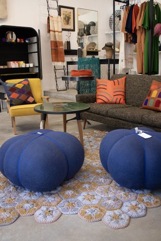 blue seats and grey and yellow sofas in cape town studio