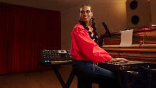 Alicia Keys at a piano in a studio