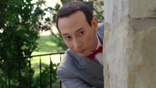 Pee-Wee peeking around corner in Pee-Wee's Big Holiday