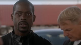 Sterling K. Brown with Mark Harman standing behind him in NCIS