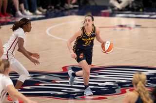 Indiana Fever guard Caitlin Clark (22) looks for teammates cutting to the basket during the WNBA game between the Indiana Fever and the Washington Mystics on September 19h, 2024