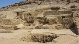 An archaeological site covered in sand