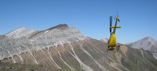 Maroon glacial deposits lay on top of a grey carbonate reef. Though the photo was taken in Canada's Yukon Territory, the land mass lay in the tropics millions of years ago, indicating just how cold the planet got.