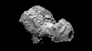 A rocky comet nucleus against a black background.