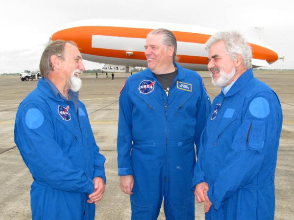 NASA researchers wait to board a zeppelin for a meteorite hunt