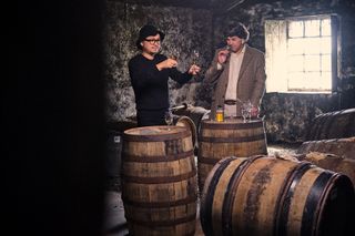 Dr Bill Lumsden x Azuma Makoto tasting whisky amid barrels