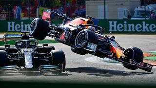 Mercedes' British driver Lewis Hamilton (L) and Red Bull's Dutch driver Max Verstappen collide during the Italian Formula One Grand Prix at the Autodromo Nazionale circuit in Monza