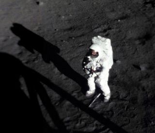 On July 20, 1969, Apollo 11 astronaut Neil Armstrong became the first man to walk on the moon. Armstrong is pictured here, shortly after collecting a sample of lunar dust and rocks. At his feet is the handle for the sample collection tool.