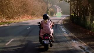 Victor Webster and Shantel VanSanten ride off into the sunset on a motorcycle in Hallmark's Love Blossoms.