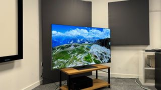 The LG G4 (OLED65G46LS) OLED TV on a TV stand in the corner of a room.