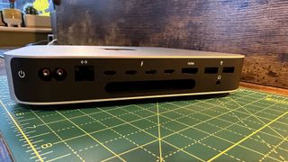 M2 Mac mini on a wooden desk