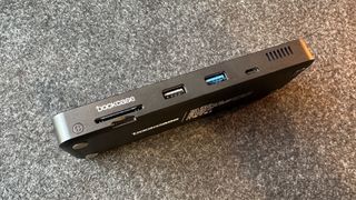 A see-through USB-C hub with an LED display.