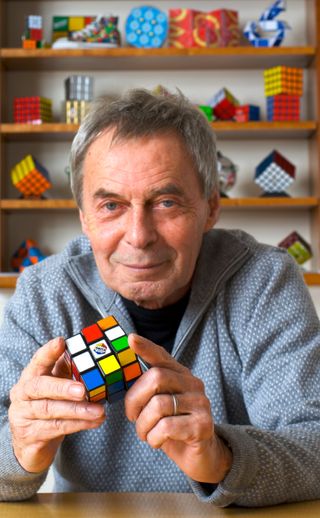 Ernő Rubik with the puzzle