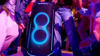 JBL Partybox Ultimate on a dancefloor surrounded by people