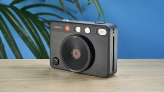 A black Leica Sofort 2 hybrid instant camera