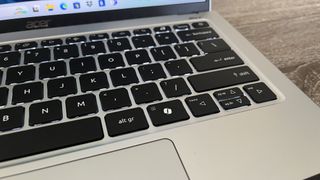 An Acer Swift Go 14 laptop keyboard showing the Copilot button