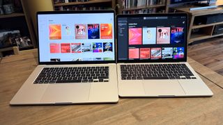 The 2024 MacBook Air M3 on a wooden table in front of a bookshelf.