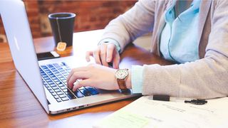 A young person using a laptop