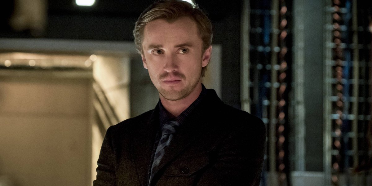 The Flash Tom Felton scowls in a server room