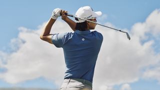 Man wearing the Lululemon ShowZero Polo while golfing