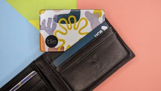 Tile Slim Bluetooth trackers inside a leather wallet.