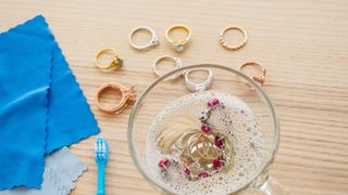 Soaking rings to clean in soapy water