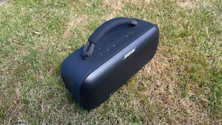 Bose SoundLink Max wireless speaker top down at slight angle on grass