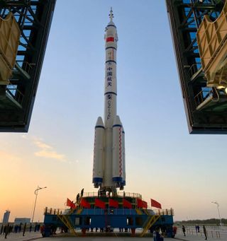 The Long March 2F to launch Shenzhou 13 crew spacecraft being vertically transferred to the pad at Jiuquan, Oc. 7, 2021.