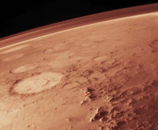 The thin atmosphere of Mars today composed mainly of carbon dioxide as depicted in this artist's illustration