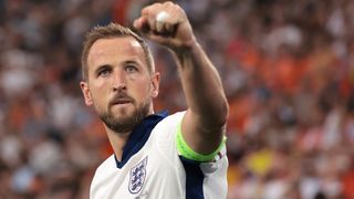 Harry Kane celebrates in close-up in his white England strip at Euro 2024.
