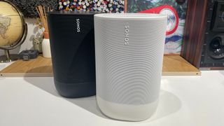 A black Sonos Move sat slightly behind a white Move 2