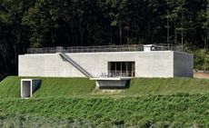 Domaine Tetta’s concrete building and vineyards