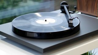 Rega Planar 1 in front of a glass window