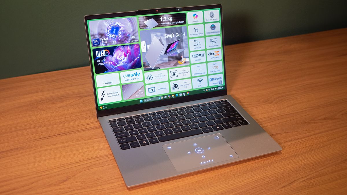 Acer Swift 14 Go (2025) on a wooden tabletop.