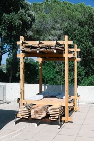 A wooden structure with cut logs