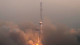 a large white and black rocket lifts off