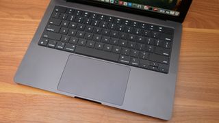 Apple MacBook Pro 14-inch M4 2024 on a wooden desk