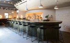 Green leathered quartzite and concrete bar at Bar Beau, New York City, USA