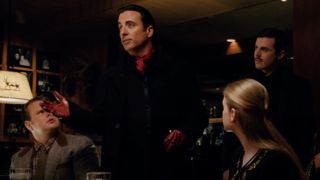 Andy Garcia talking to a group of people. There are two people seated on either side of him, and Casey Affleck is standing behind him.