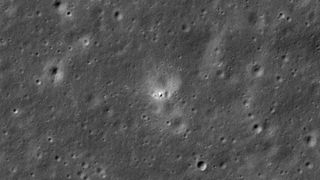 a chinese spacecraft is seen as a small white spot on the moon's gray, cratered far side