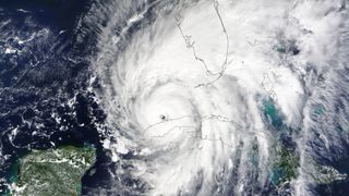 hurricane ian in white over land and water in satellite image